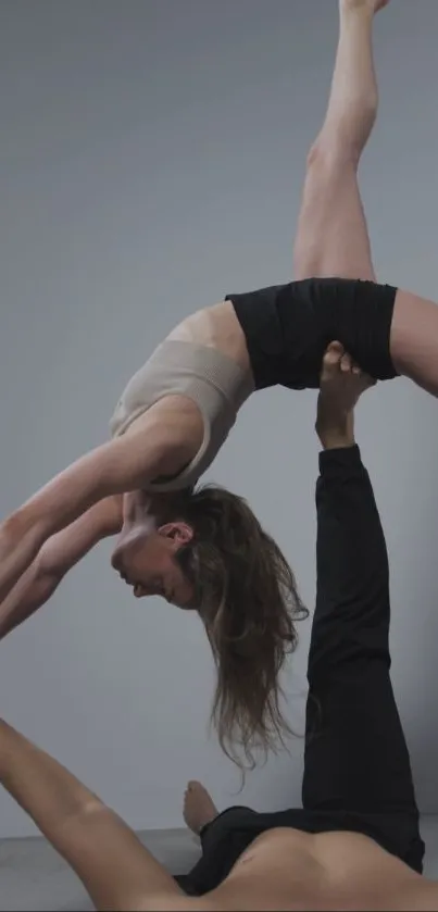 Acrobatic yoga pose showcasing balance and strength.