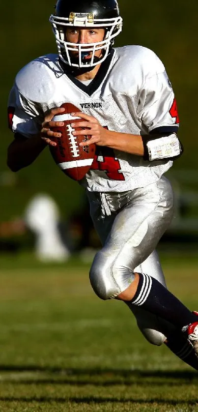 American football player in mid-action running on the field.