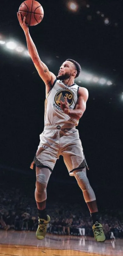 Basketball player in action, leaping for a shot on a dimly lit court.