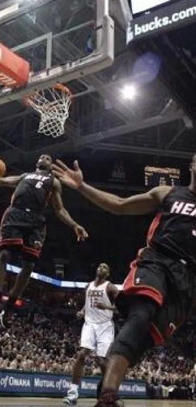 Action-packed basketball game with players mid-play on court.