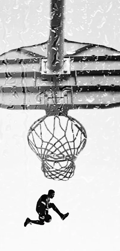 Black and white basketball player jumping to dunk. Dynamic sports wallpaper image.