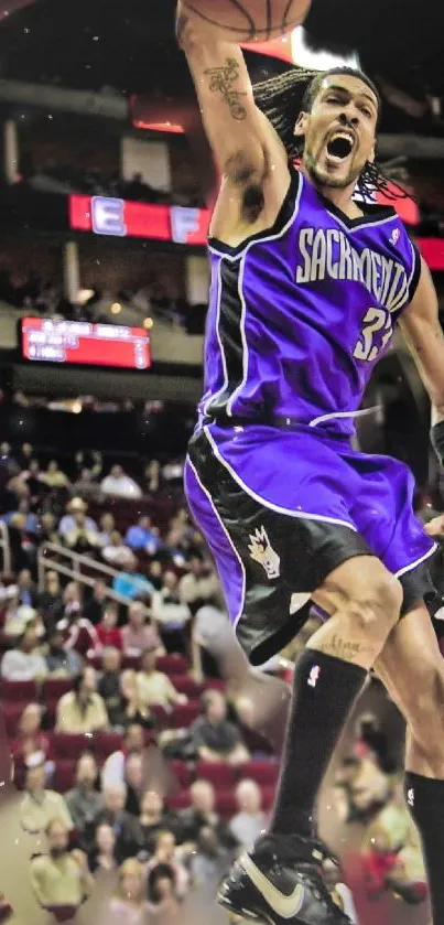 Exciting basketball slam dunk in purple jersey.