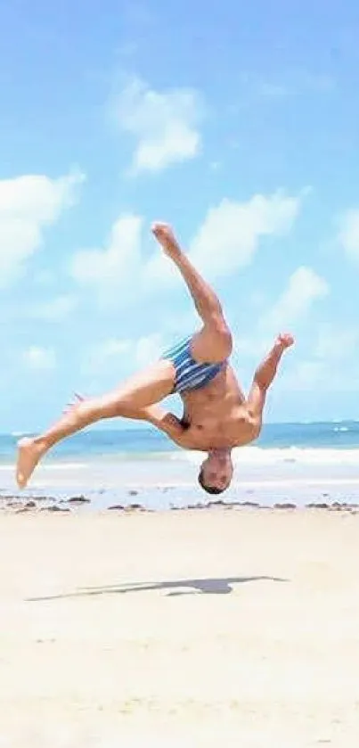 Vibrant beach acrobatics on a sunny day with a blue sky backdrop, energizing scene.