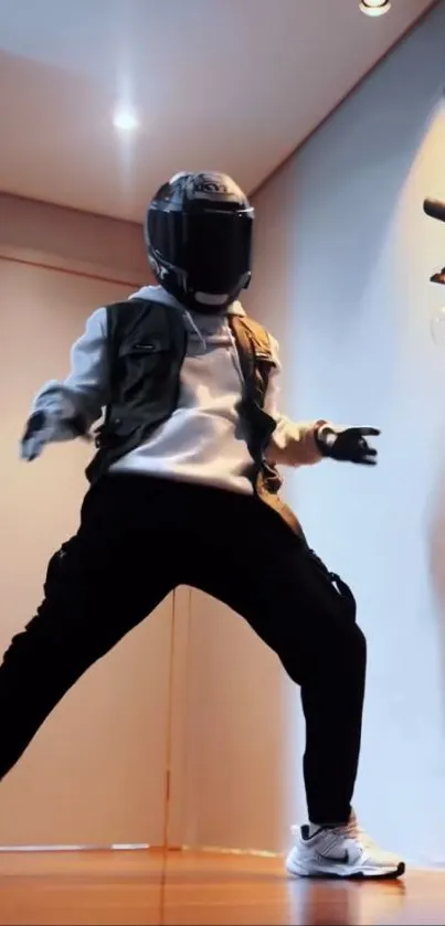 Person in helmet posed indoors with dynamic stance.