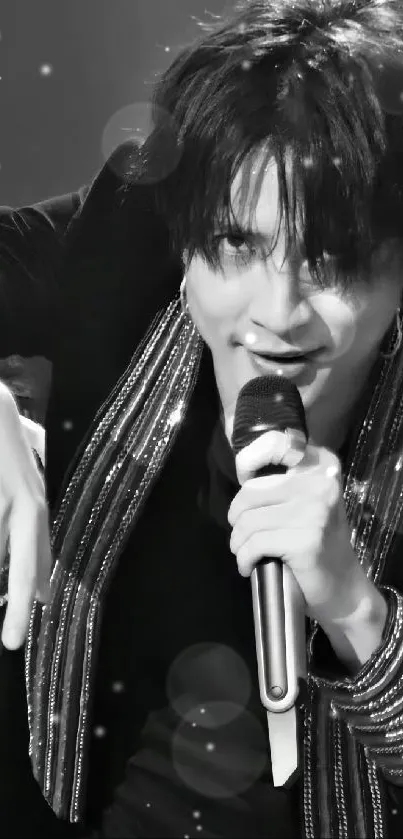 Charismatic lead singer in dynamic black and white concert setting.