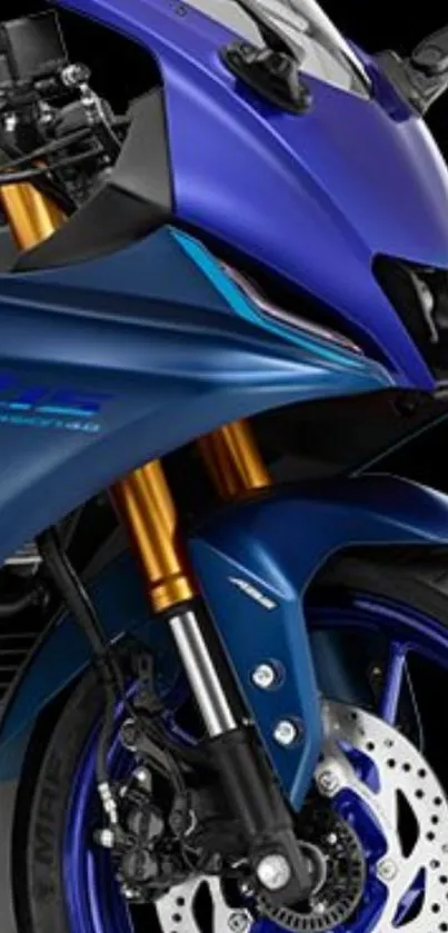 Sleek blue sport motorcycle with dynamic design on black background.