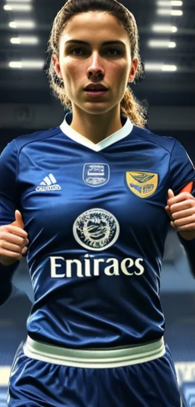 Soccer player in blue jersey on the field with stadium lights.