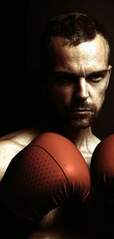 Boxer with red gloves in intense focus, dark background.