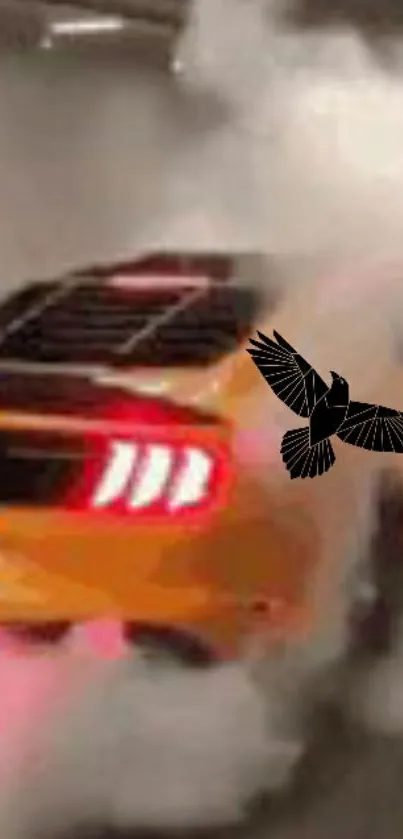 Orange car performing burnout with smoke and black bird design.