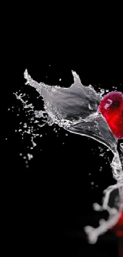 Dynamic splash of red cherries against a black backdrop, creating a vibrant effect.