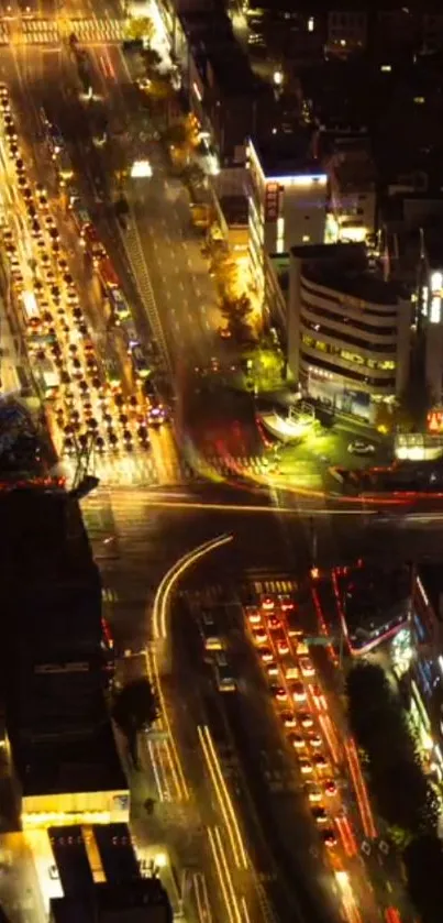 Aerial view of a vibrant city at night with bustling traffic and bright lights.