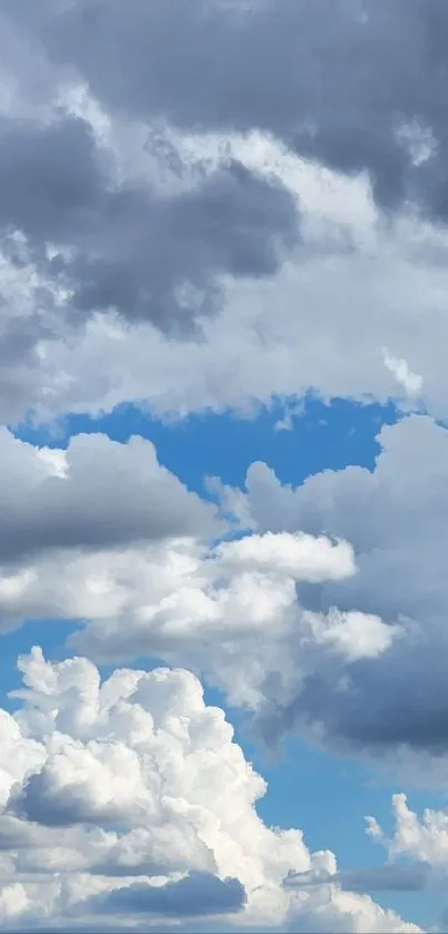 Dynamic clouds against a vibrant blue sky, perfect for a nature-inspired mobile wallpaper.