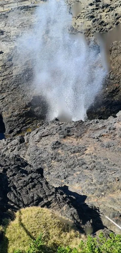 Dynamic coastal rock formation with water spray.