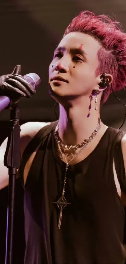 Dynamic singer performing on stage with magenta hair, holding a microphone.