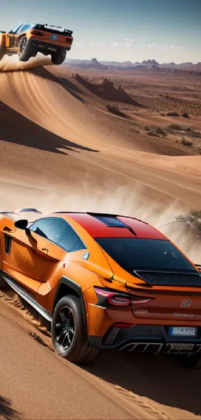 Two orange cars racing through desert dunes under a blue sky.