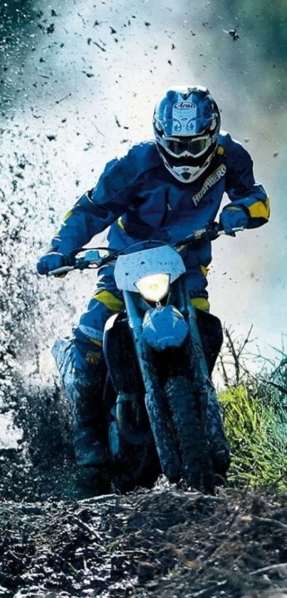 Rider on a dirt bike racing through mud and water.