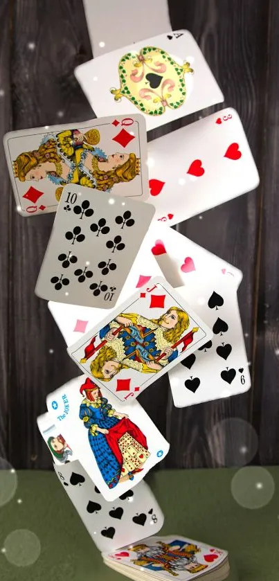 Dynamic playing cards cascade against wooden background wallpaper.