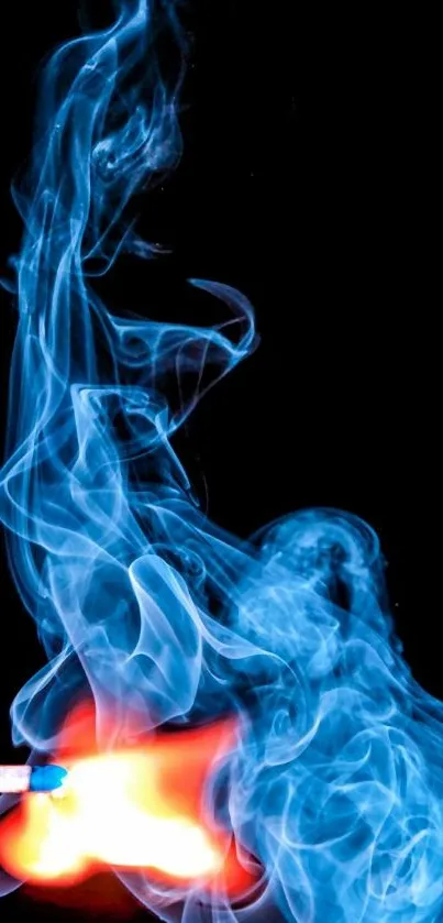 Blue smoke and vibrant flame on black wallpaper.