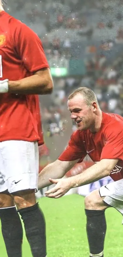 Soccer players in red jerseys during a match, capturing a dynamic moment on the field.