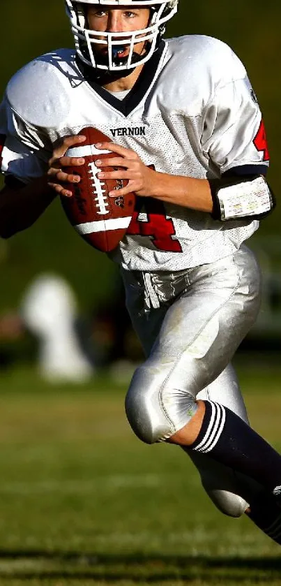 Football player running on the field in action.