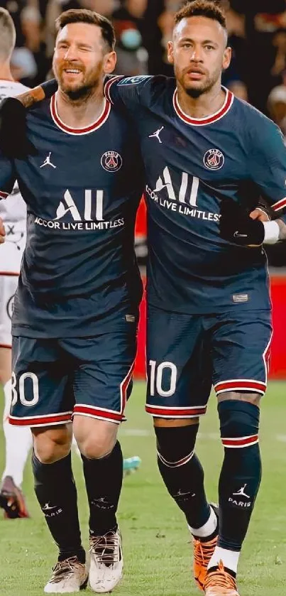 Football players in navy kits celebrating on the field.