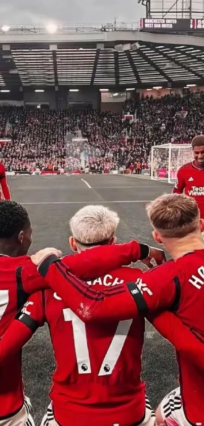 Football player celebration on stadium field.