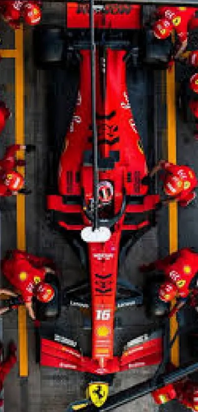 Formula 1 car in pit stop scene with crew, red theme.