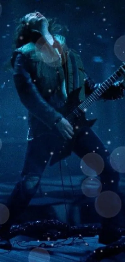 Dynamic guitarist playing electric guitar in dark blue tones on mobile wallpaper.