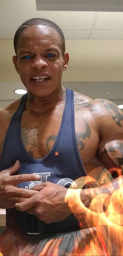 Muscular athlete in gym surrounded by flames.