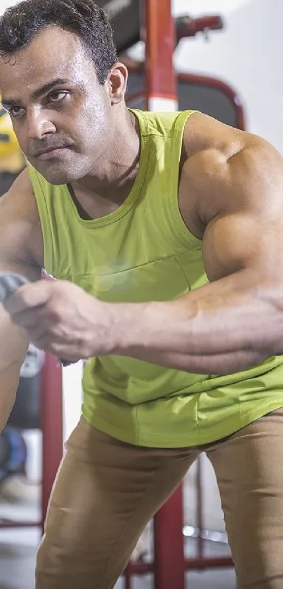 Man intensely training with battle ropes in the gym.