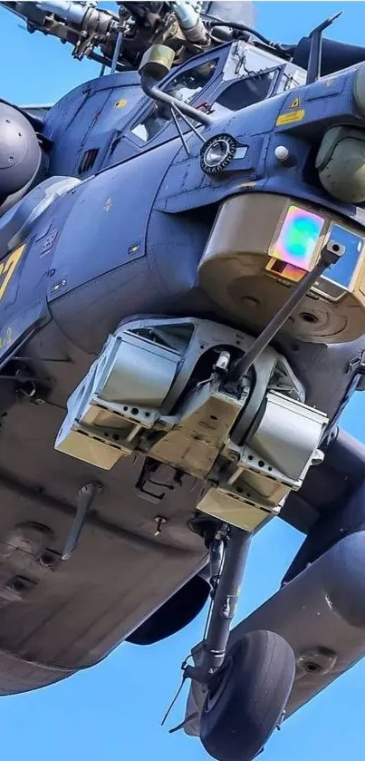 Close-up view of a helicopter in flight against a blue sky.