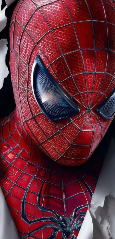 Close-up of superhero in red suit breaking through paper.