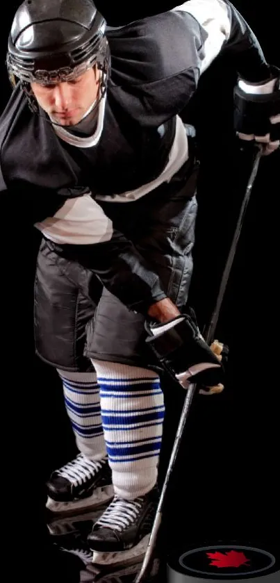 Focused hockey player on black background.