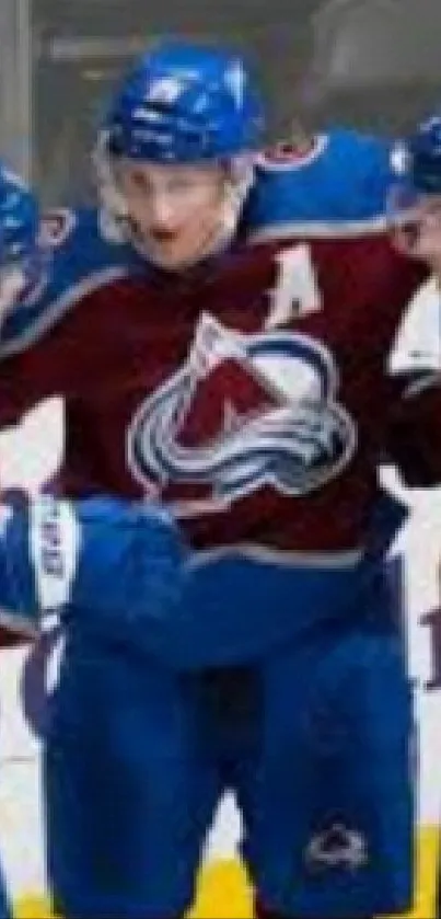 Hockey team celebrating on ice in vibrant jerseys.