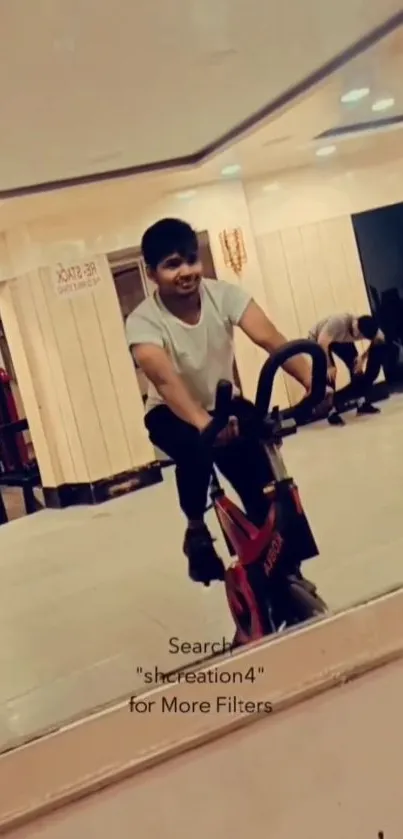 Mobile wallpaper of a young man cycling indoors at a gym.