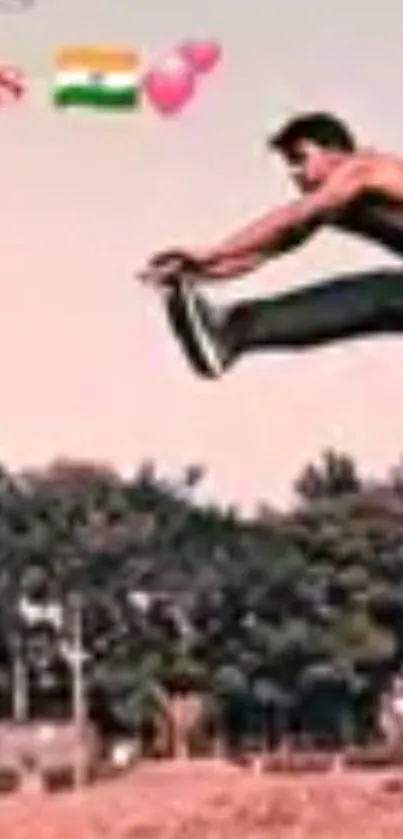 Silhouette of a man jumping against a pastel sky and lush greenery background.