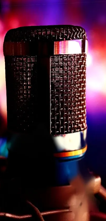 Vibrant microphone against colorful purple stage lighting.