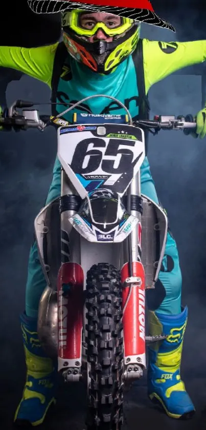 Motocross rider in vibrant teal gear on a dirt bike.