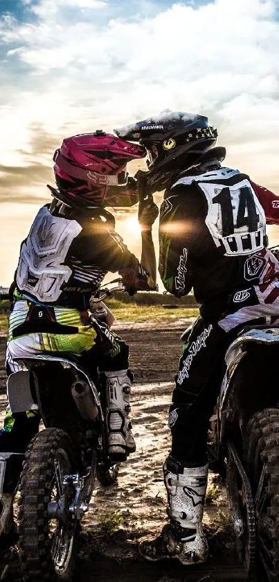 Motocross riders at sunset on a muddy track.