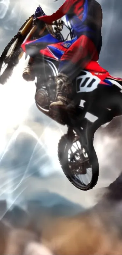 Motocross rider jumping high in the sky on a dirt bike amidst clouds.