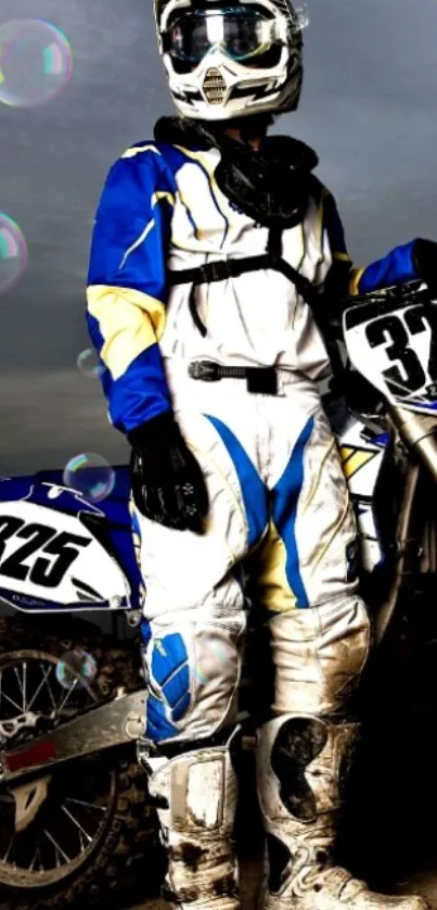 Motocross rider in blue and white gear with bike, number 325.