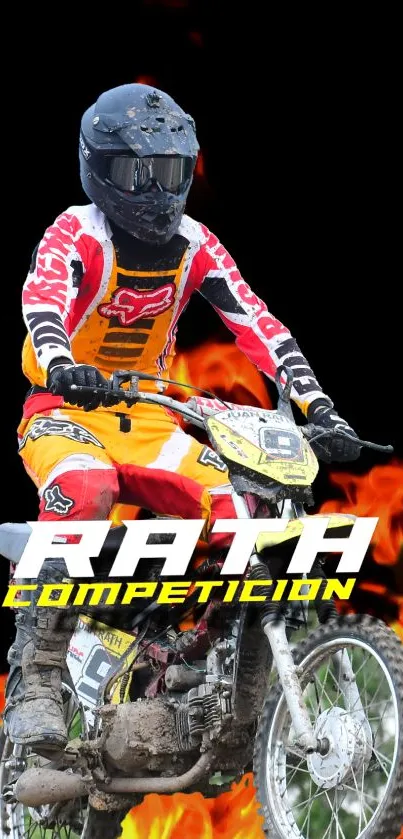 Motocross rider in full gear racing through flames against a dark background.