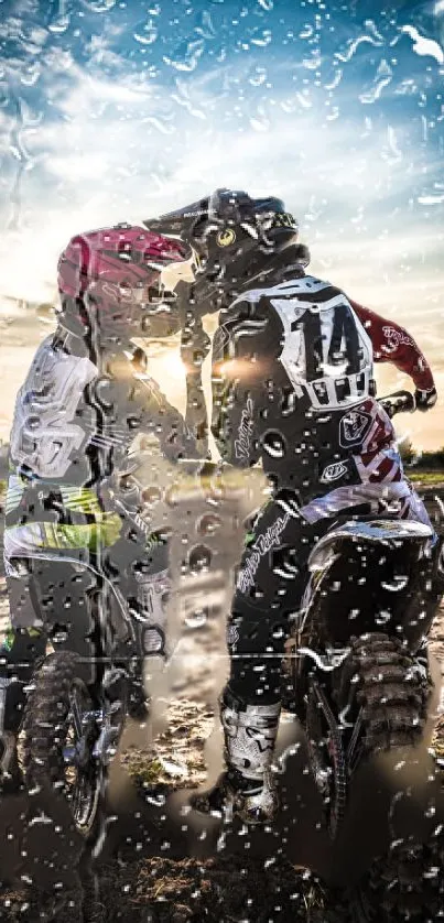 Two motocross riders in rainy sunset.