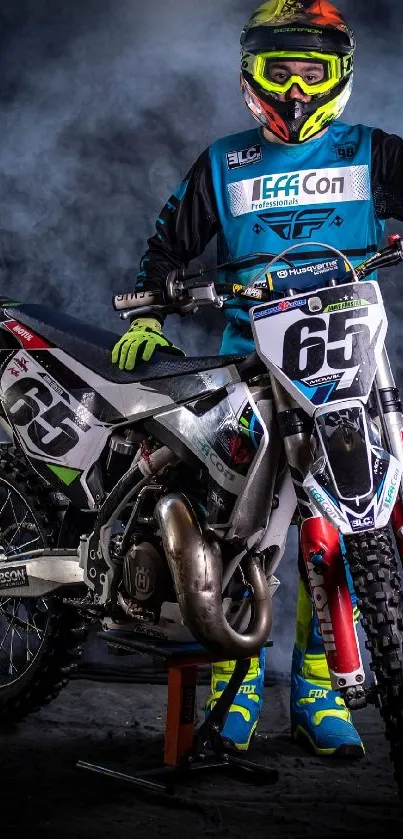 Motocross rider with bike in action-ready pose.