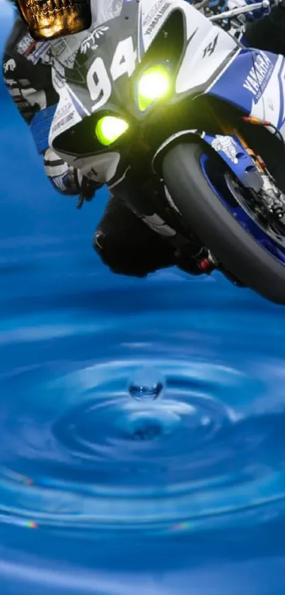 High-speed motorbike racing over blue water ripples wallpaper.