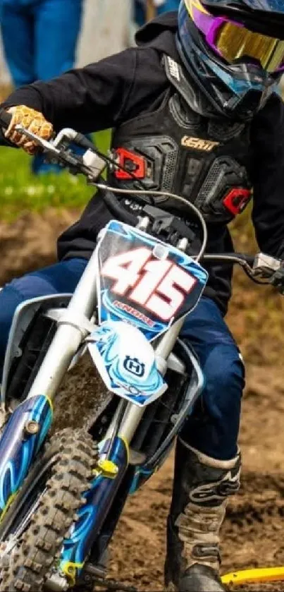 Motocross rider on dirt bike in action.