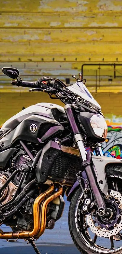 Motorcycle parked in a colorful alley with graffiti art surrounding it.