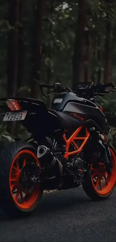 A dynamic motorcycle with orange details parked in a lush forest setting.