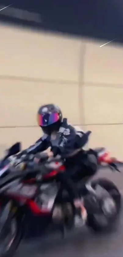 Motorcycle rider in motion with blurred background.