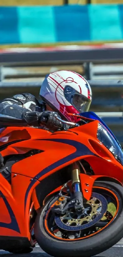 Vibrant orange motorcycle racing on track, capturing speed and excitement.